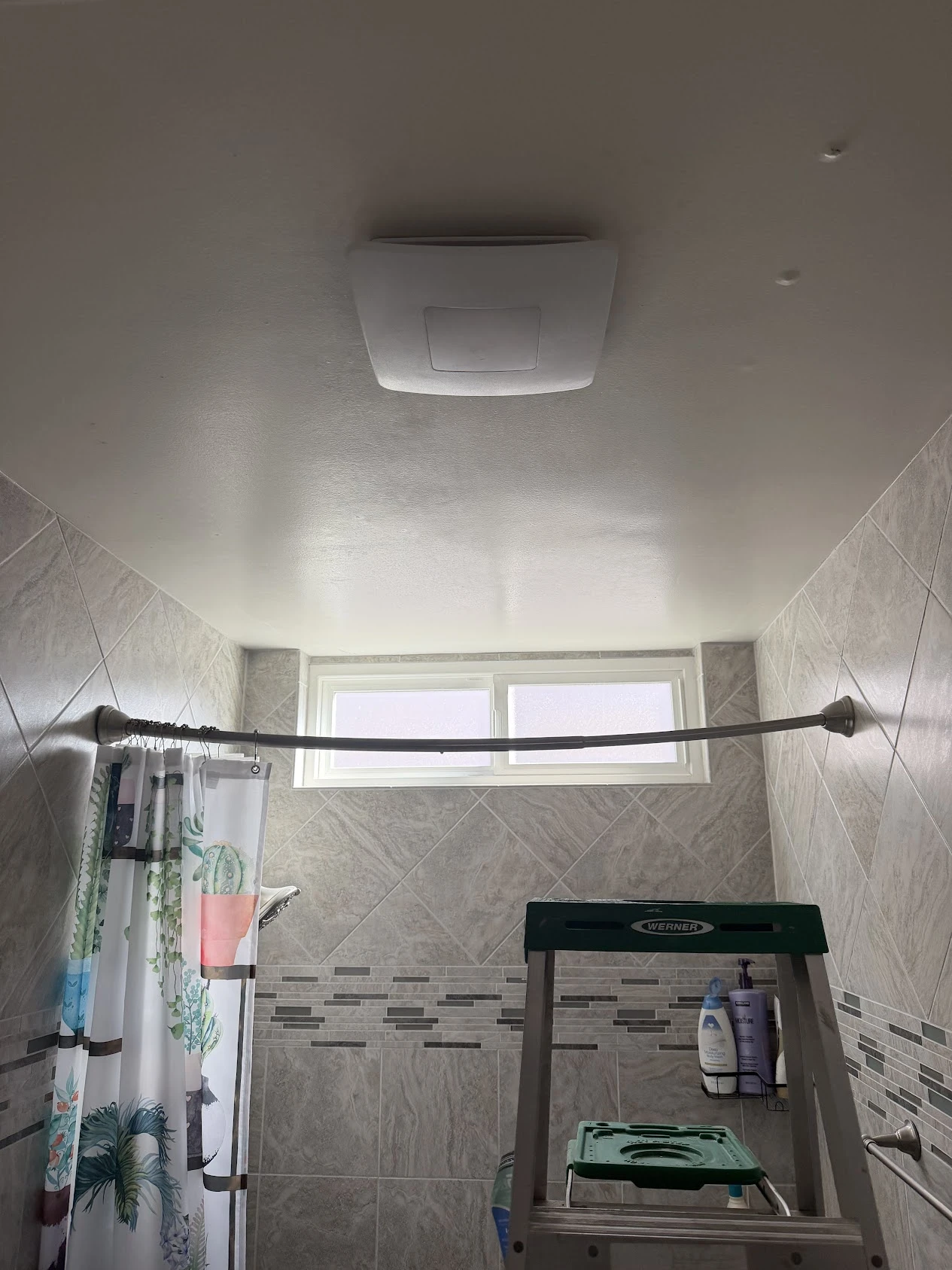 Actual project: a white ceiling fixture installed in a bathroom